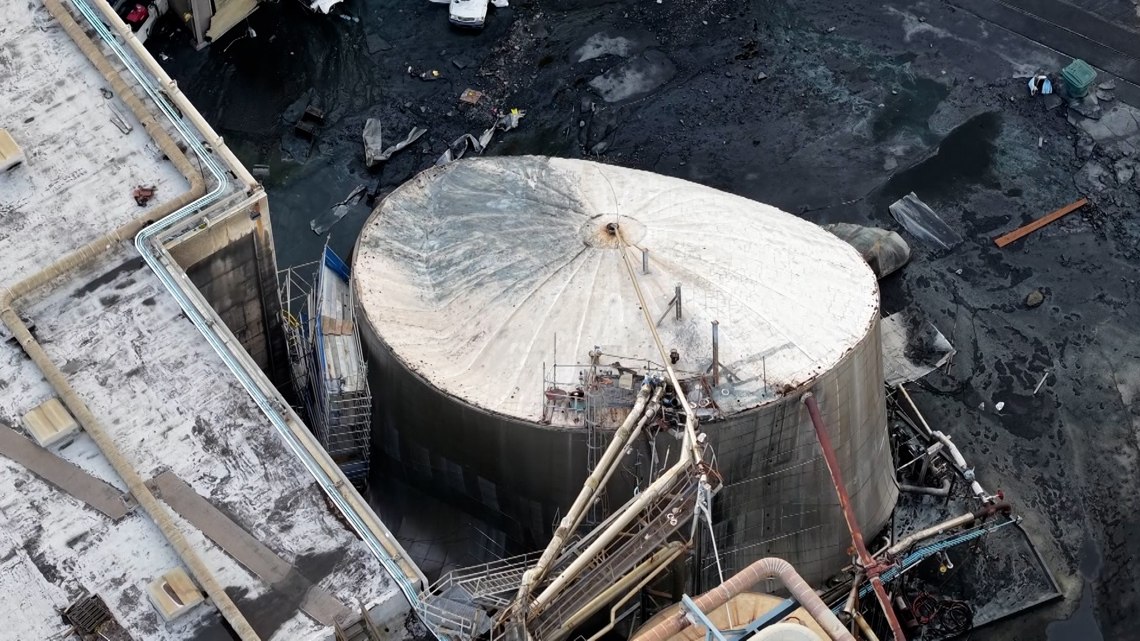 A tank holding 900,000 gallons of corrosive chemicals imploded. Experts say something went very wrong